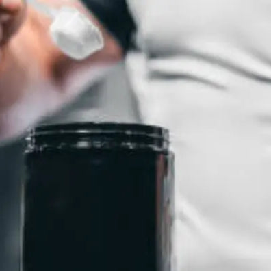 Man scooping protein powder