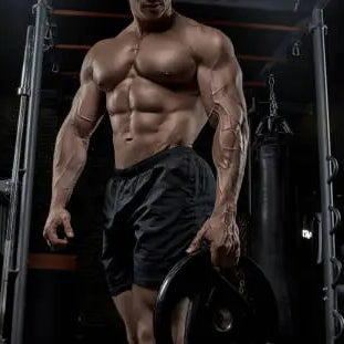 Man who is very bulk in the gym working out his msucles ot build them and get bigger and have mass gains 