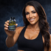 Athletic fitness model smiling while holding a bottle of Lipodrene® Hardcore with Ephedra 90 tablets