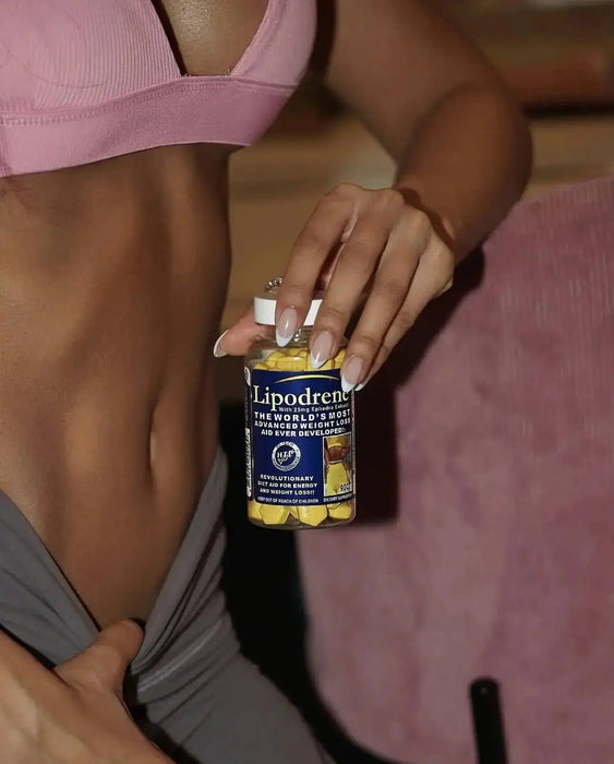 Lipodrene® with Ephedra 90 count bottle with yellow tablets held by fitness model in pink sports bra
